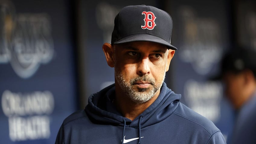 Boston Red Sox manager Alex Cora looks on from dugout