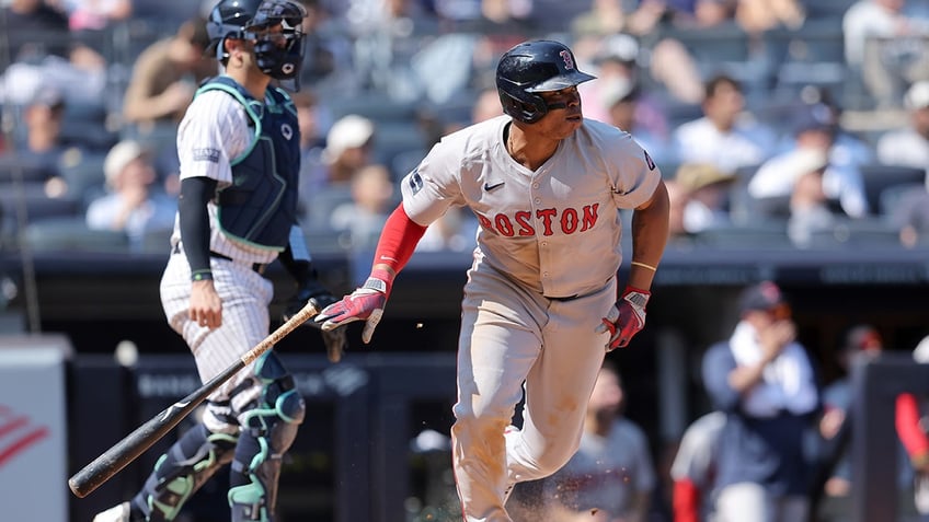 Rafael Devers hits ball