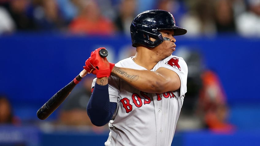 Rafael Devers swinging