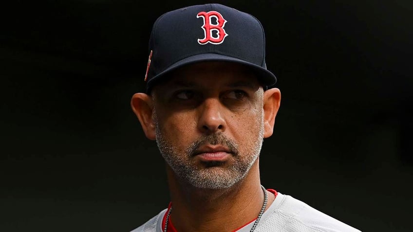 Alex Cora looks on from dugout