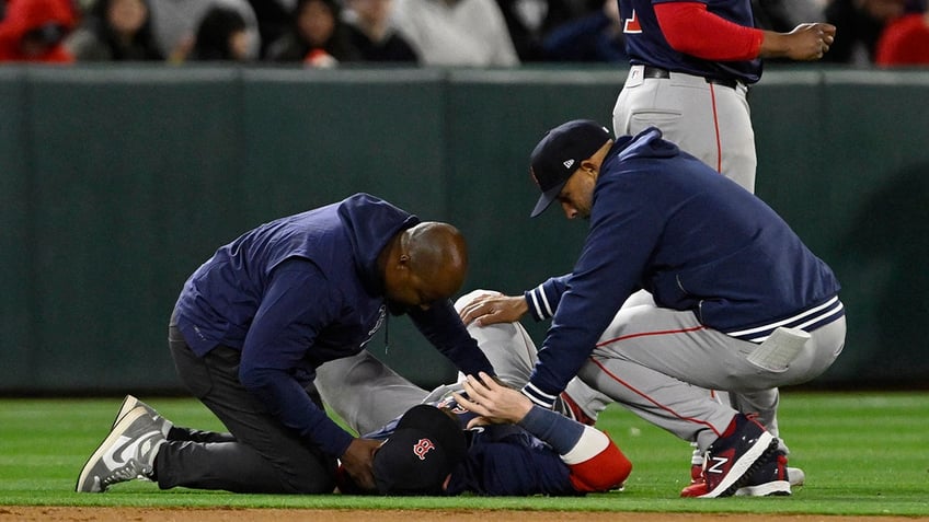 Trevor Story with trainers hurt