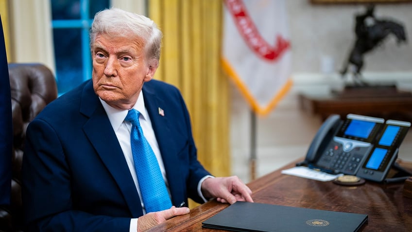 Trump at desk in Oval Office