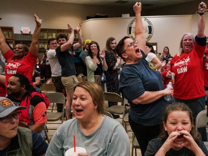 CHATTANOOGA, TENNESSEE - APRIL 19: People celebrate after the United Auto Workers (UAW) re