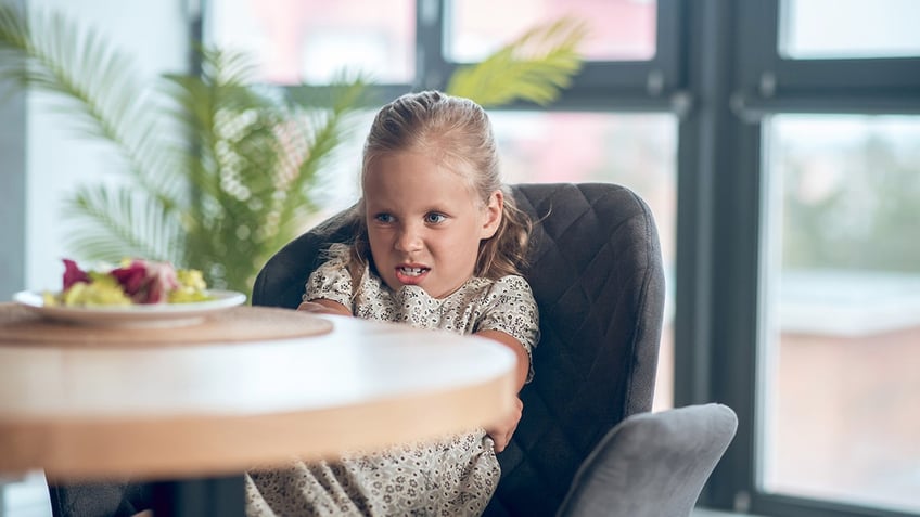 girl looking mad at food