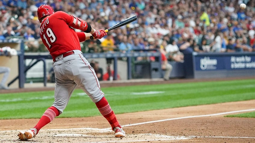 reds survive ninth inning surge from brewers to move within half game of nl central lead