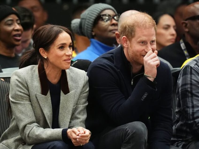 RETRANSMITTING ADDING KEYWORDS The Duke and Duchess of Sussex during the USA v Nigeria whe
