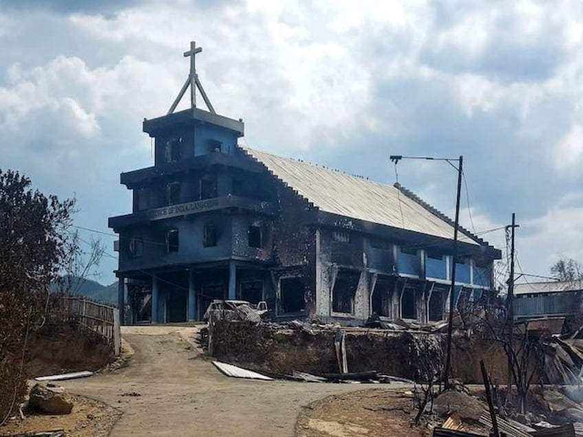 The remains of a burnt church are seen in Langching village some 45 km from Imphal on May 31, 2023, during ongoing ethnic violence in India's northeastern Manipur state. Fresh deadly clashes were reported on May 28 in the remote northeastern Indian state of Manipur although the exact number of …