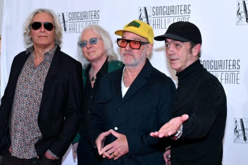 R.E.M. band members Peter Buck, Mike Mills, Michael Stipe and Bill Berry attend the Songwr