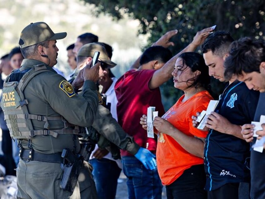 JACUMBA HOT SPRINGS, CA - MAY 26: Migrants are processed by the U.S. Border Patrol at a ne