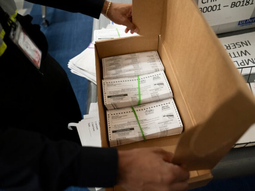 Absentee ballots are prepared to be mailed at the Wake County Board of Elections on Septem