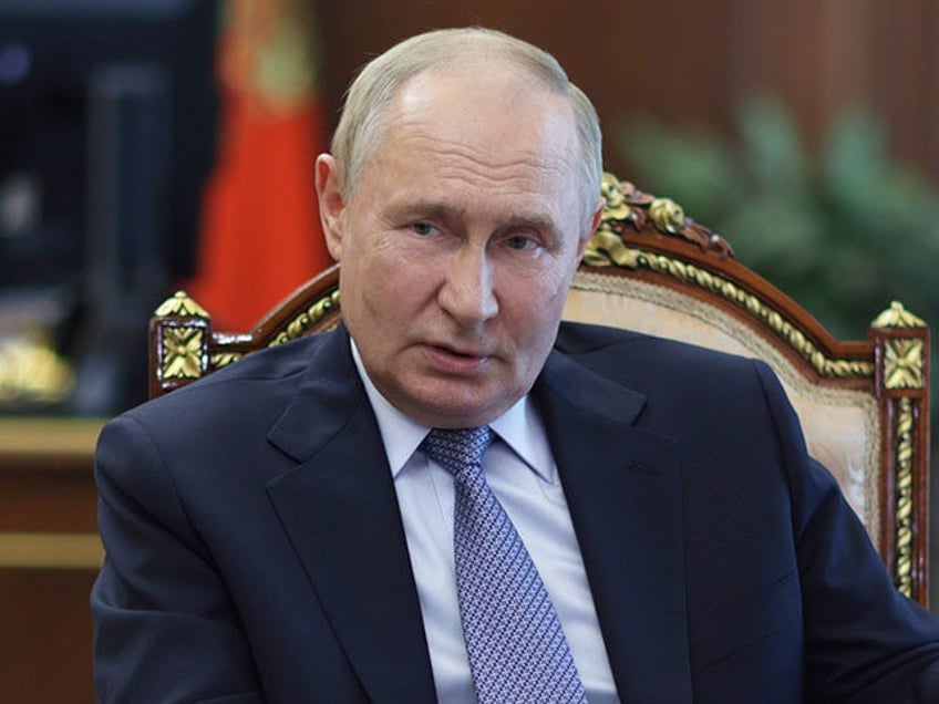 Russian President Vladimir Putin gestures during his meeting with Murmansk region Governor