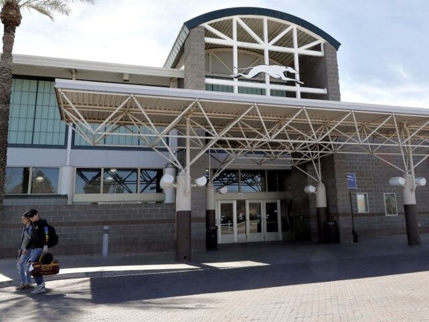 A Greyhound bus terminal is shown Friday, March 15, 2019, in Phoenix. Greyhound Lines Inc. is no longer allowing U.S. authorities to drop off immigrant families inside bus stations, forcing those who have been released from custody to wait outside until they have a ticket. (Matt York/AP)