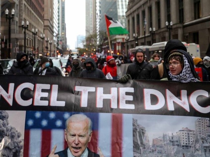 Demonstrators march in protest of the City of Chicago's plan to host the upcoming 202