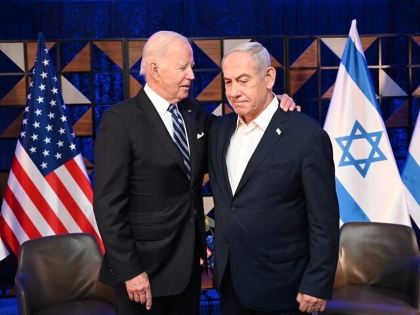 TEL AVIV, ISRAEL - OCTOBER 18: (----EDITORIAL USE ONLY - MANDATORY CREDIT - 'ISRAELI GOVERNMENT PRESS OFFICE (GPO) / HANDOUT' - NO MARKETING NO ADVERTISING CAMPAIGNS - DISTRIBUTED AS A SERVICE TO CLIENTS----) US President Joe Biden (L) and Prime Minister Benjamin Netanyahu (R) meet in Tel Aviv, Israel on …