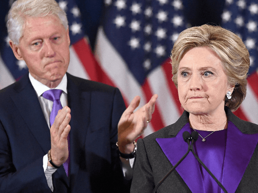 US Democratic presidential candidate Hillary Clinton makes a concession speech after being defeated by Republican President-elect Donald Trump, as former President Bill Clinton looks on in New York on November 9, 2016. / AFP PHOTO / JEWEL SAMAD (Photo credit should read JEWEL SAMAD/AFP via Getty Images)