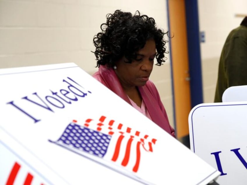 FILE - Voters fill out their ballots at a polling place, Feb. 29, 2020, in Charleston, S.C