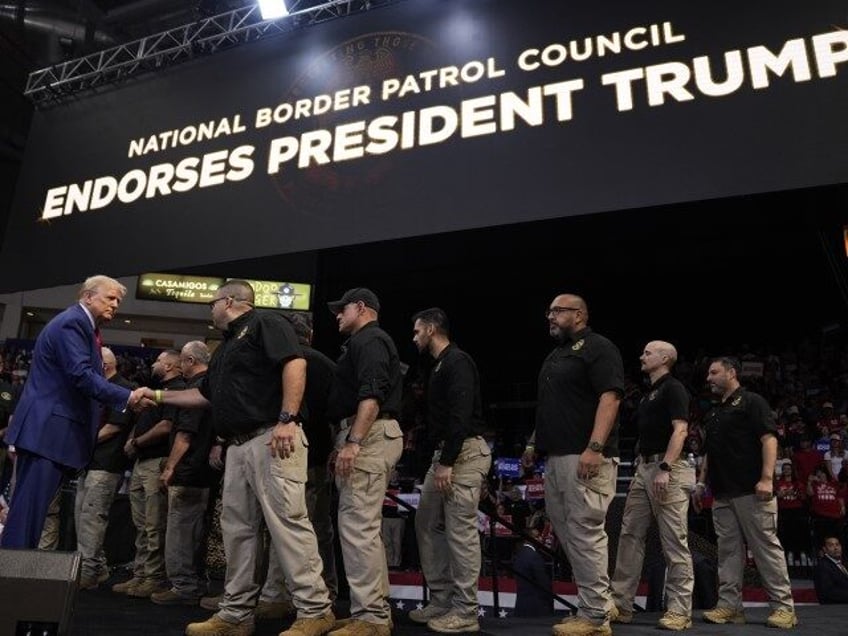 Republican presidential nominee former President Donald Trump greets members of the U.S. B