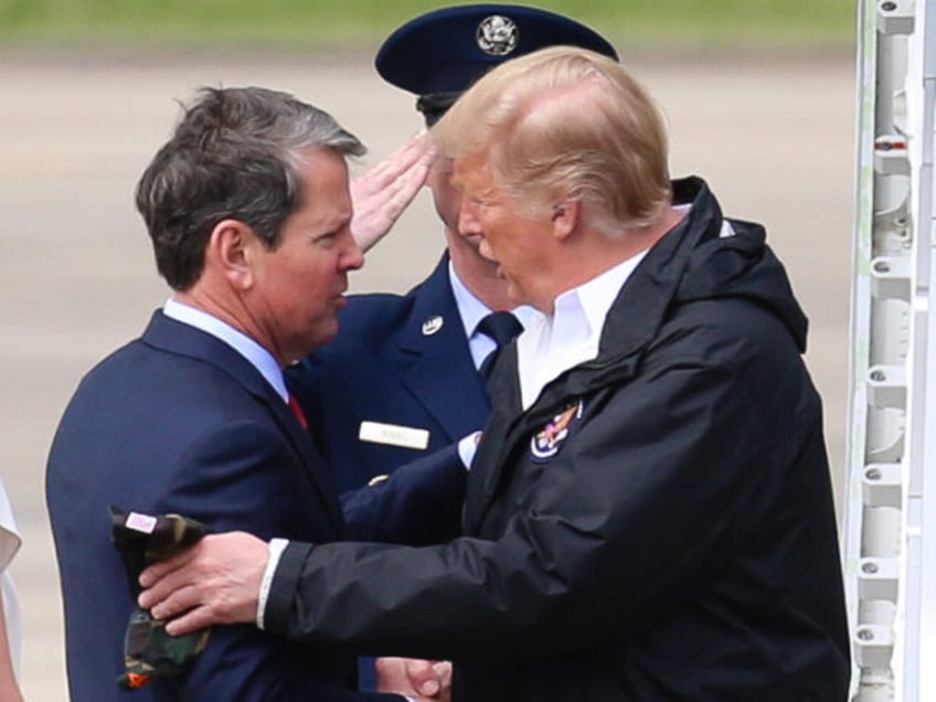 U.S. President Donald Trump, shakes hands with Brian Kemp, governor of Georgia, third righ