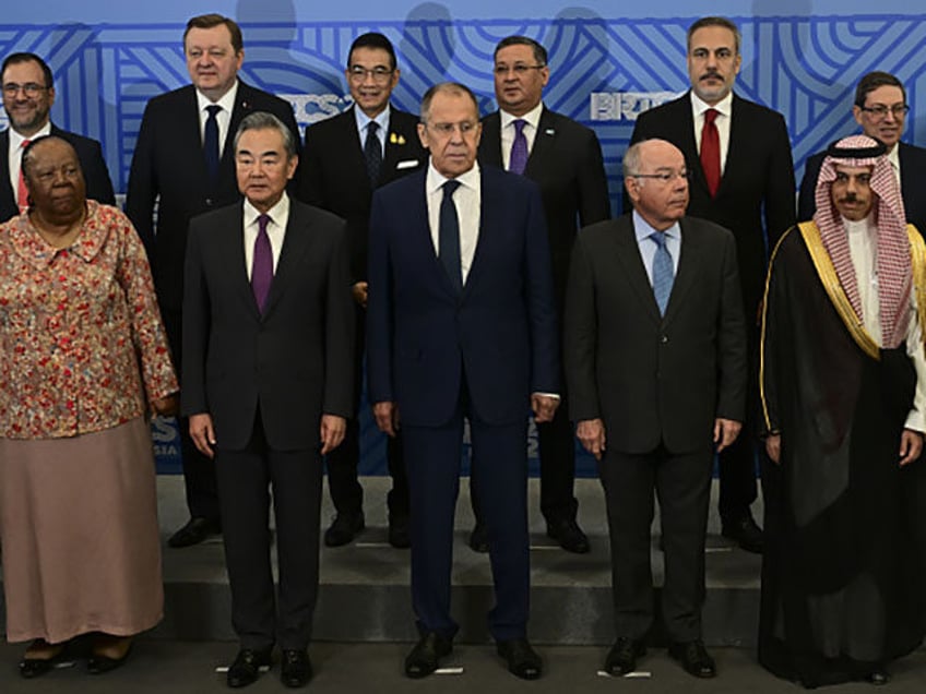 Turkish Foreign Minister Hakan Fidan (rear 2nd R) poses for a family photo with the offici