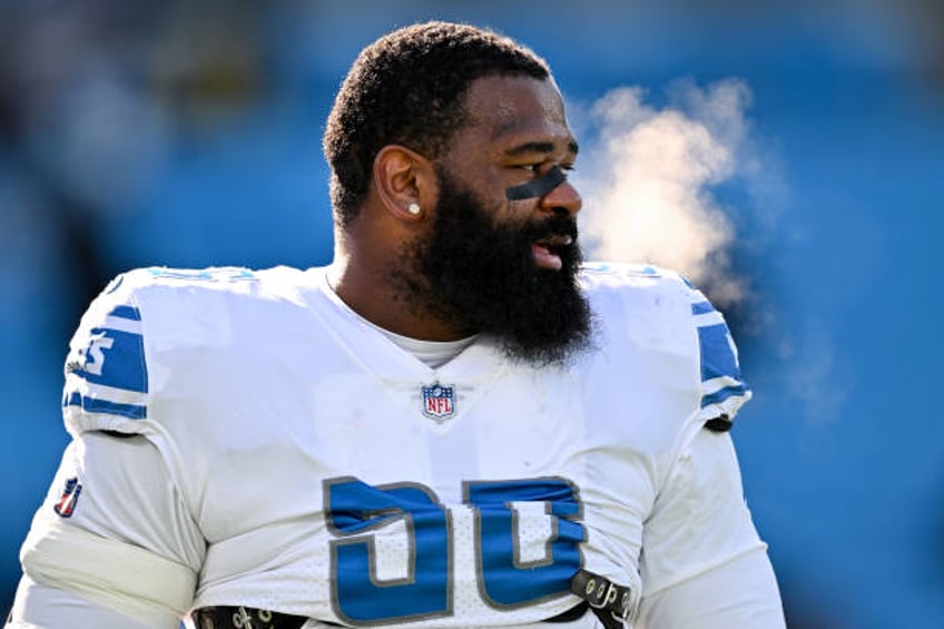 Isaiah Buggs of the Detroit Lions looks on before the game against the Carolina Panthers at Bank of America Stadium on December 24, 2022 in...