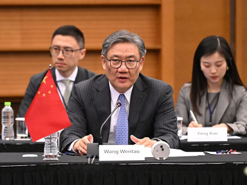 China's Commerce Minister Wang Wentao speaks during the 13th Trilateral Economic and