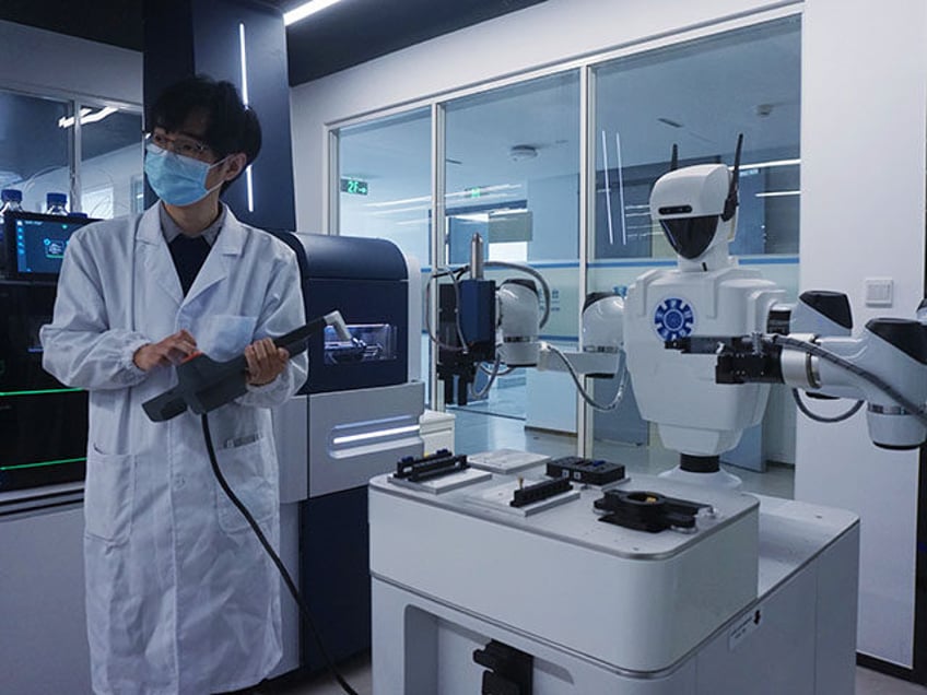 A scientific researcher operates a microfluidic liquid handling robot of Single-cell Prote