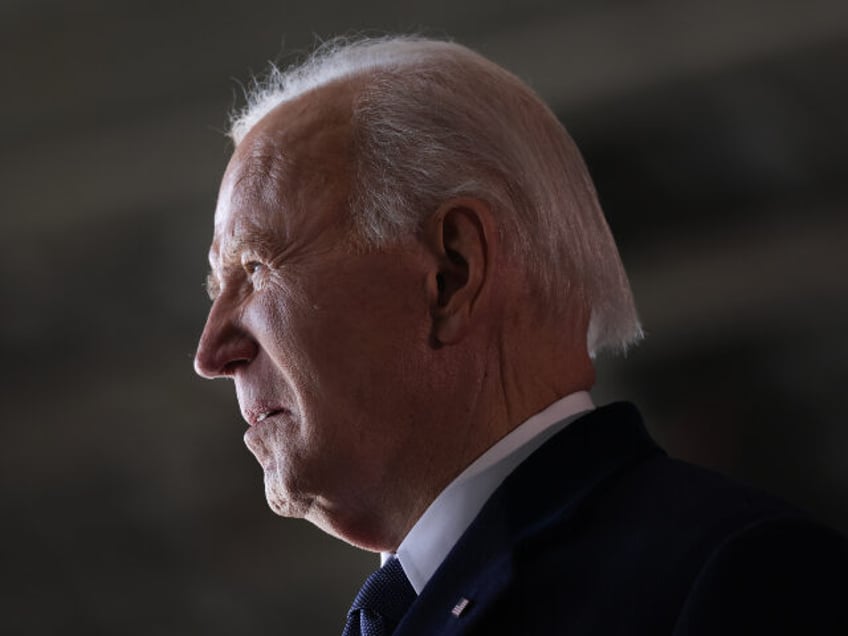 Former U.S. President Joe Biden gestures while arriving at Joint Base Andrews following in