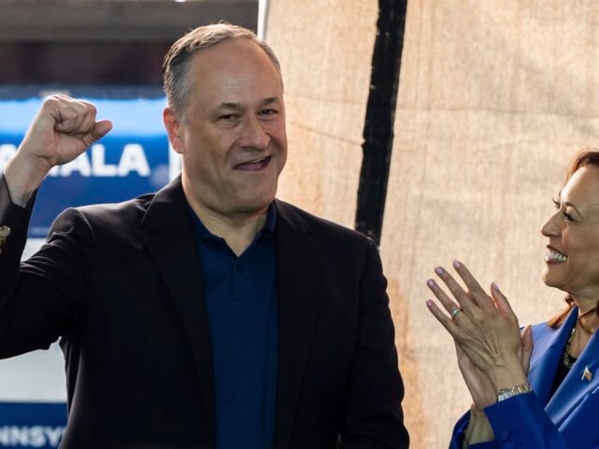 Democratic presidential nominee Vice President Kamala Harris looks at second gentleman Dou