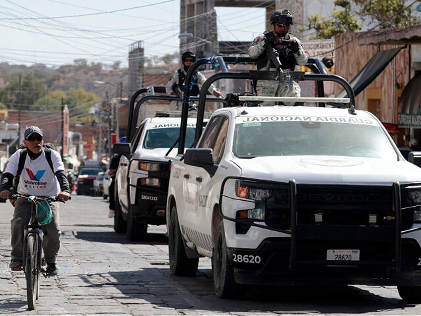 National Guard officers on a pickup truck patrol as part of a permanent operation in the m