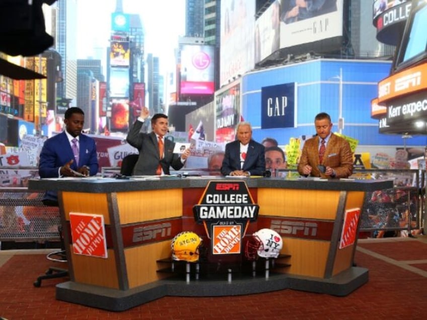 Lee Corso, Kirk Herbstreit, Chris Fowler are seen during ESPN's College GameDay show at Times Square on September 23, 2017 in New York City.