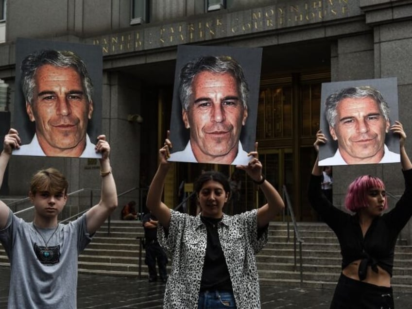 NEW YORK, NY - JULY 08: A protest group called "Hot Mess" hold up signs of Jeffr