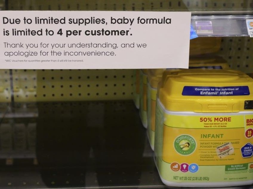 A due to limited supplies sign is displayed on the baby formula shelf at a grocery store T