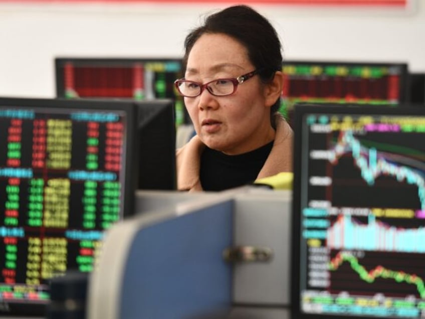 FUYANG, CHINA - DECEMBER 5, 2023 - Investors pay attention to the stock market at a securities business hall in Fuyang city, East China's Anhui province, Dec 5, 2023. (Photo credit should read CFOTO/Future Publishing via Getty Images)