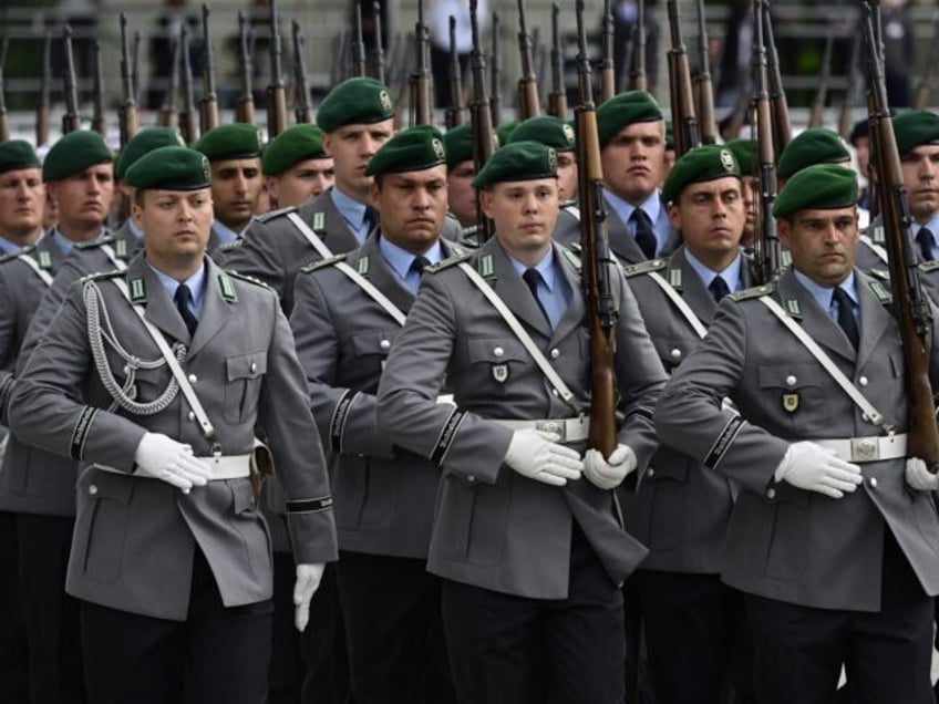 An honour guard marches out at the end of a swearing-in ceremony of German Bundeswehr soldiers in remembrance of the resistance to the Nazi Regime in the Bendler Block, at the Ministry of Defence in Berlin, on July 20, 2023. (Photo by John MACDOUGALL / AFP) (Photo by JOHN MACDOUGALL/AFP …