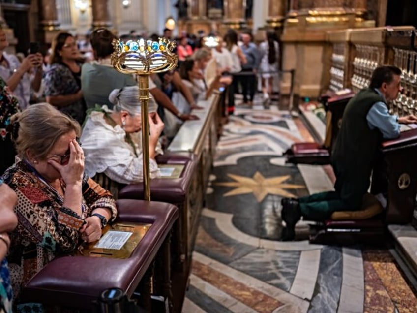 Believers inside the Cathedral-Basilica of Our Lady of the Pillar during The Offering of F