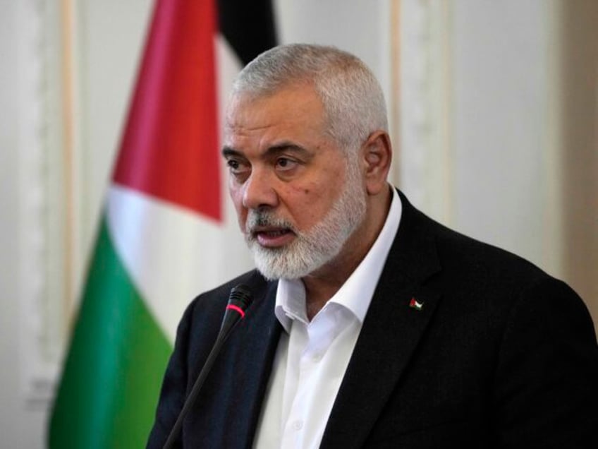 FILE - Hamas chief Ismail Haniyeh speaks during a press briefing after his meeting with Ir