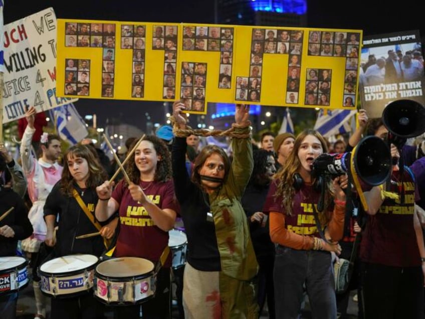 People shout slogans during a protest against Prime Minister Benjamin Netanyahu's gov