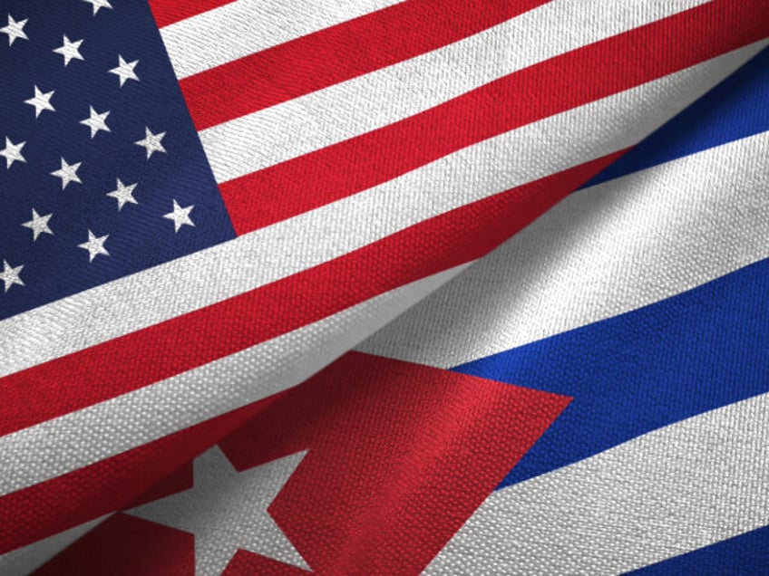 United States and Cuba two flags textile cloth - stock photo