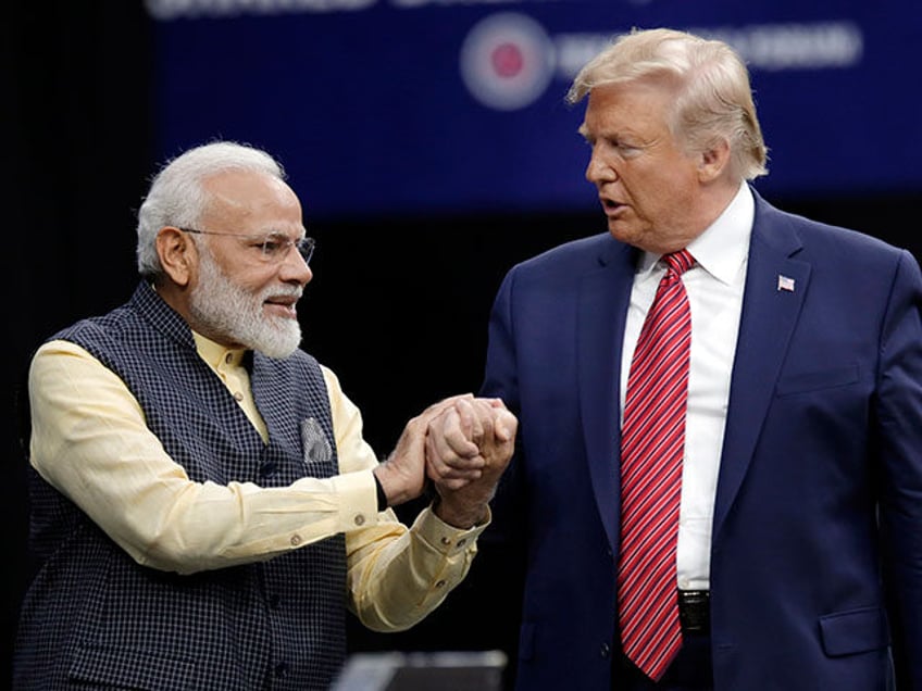 Prime Minister Narendra Modi and President Donald Trump, right, shake hands after introduc