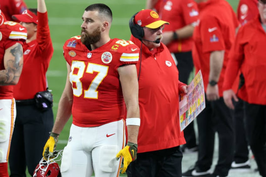 Travis Kelce and Head coach Andy Reid of the Kansas City Chiefs look on in the second quarter against the San Francisco 49ers during Super Bowl LVIII...