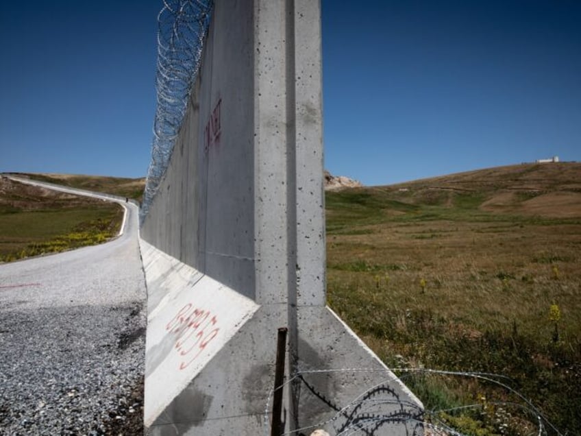 CALDIRAN, TURKEY - JULY 10: An Iranian border outpost, far right, is seen behind a part of