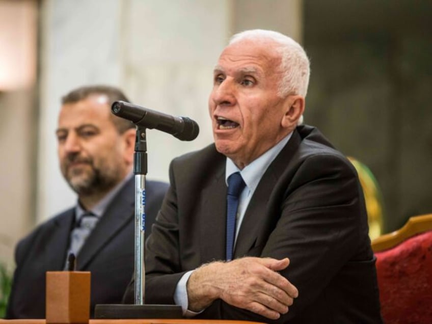 Hamas' representative, Saleh al-Arouri, is pictured during the signing of a reconciliation deal between the Islamic Resistence Movement (Hamas) and Fatah in Cairo on October 12, 2017, as the two rival Palestinian movements ended their decade-long split following negotiations overseen by Egypt. Under the agreement, the West Bank-based Palestinian Authority …