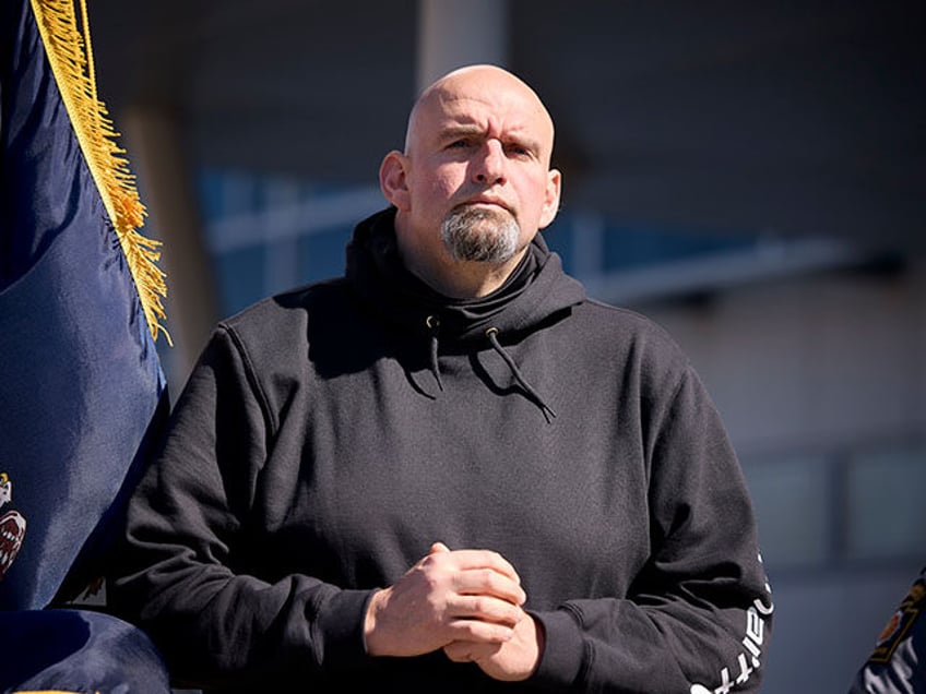 Lt. Gov. John Fetterman listening to speakers. Pennsylvania State Police (PSP) Commissione