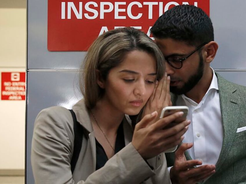 Attorney Nasrina Bargzie (left) talks with Mokhtar Alkhanshali (right) of Mocha Mill upon