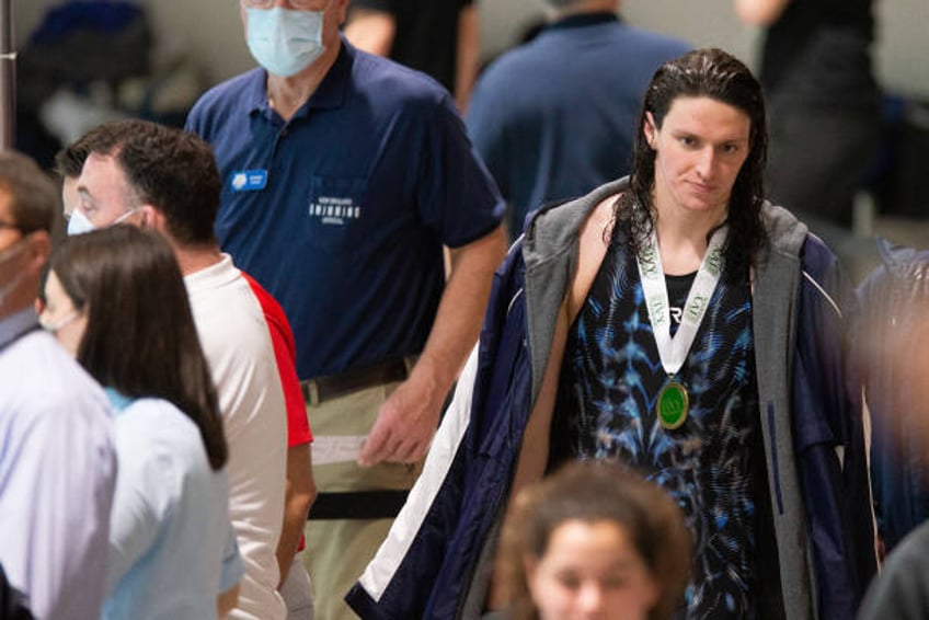 University of Pennsylvania swimmer Lia Thomas walks after receiving her medal for winning the 200 yard freestyle during the 2022 Ivy League Women's...