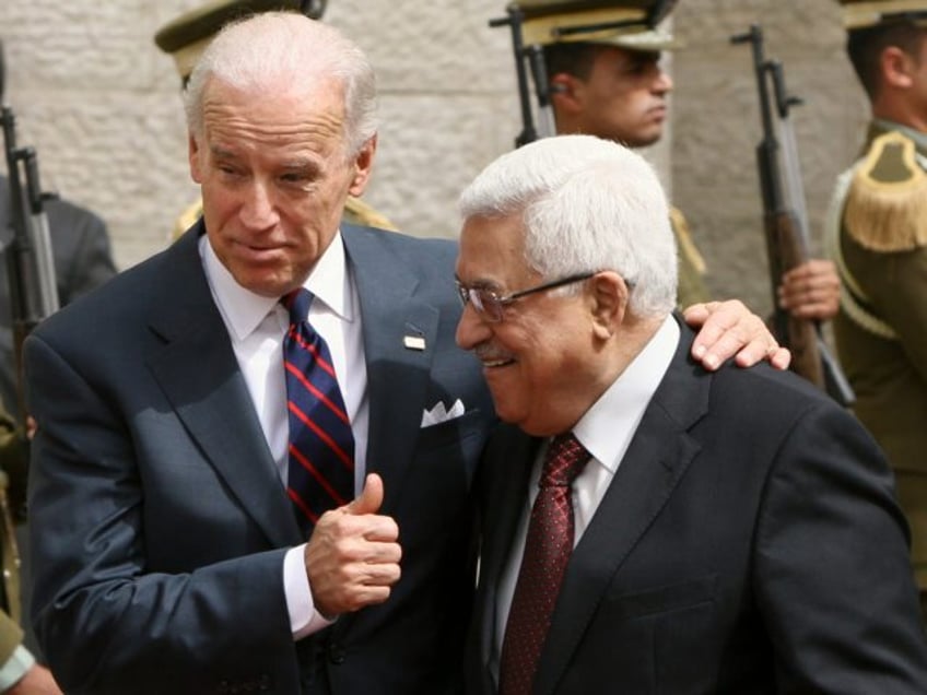 U.S. Vice President Joseph Biden, left, gestures as he walks with Palestinian President Ma