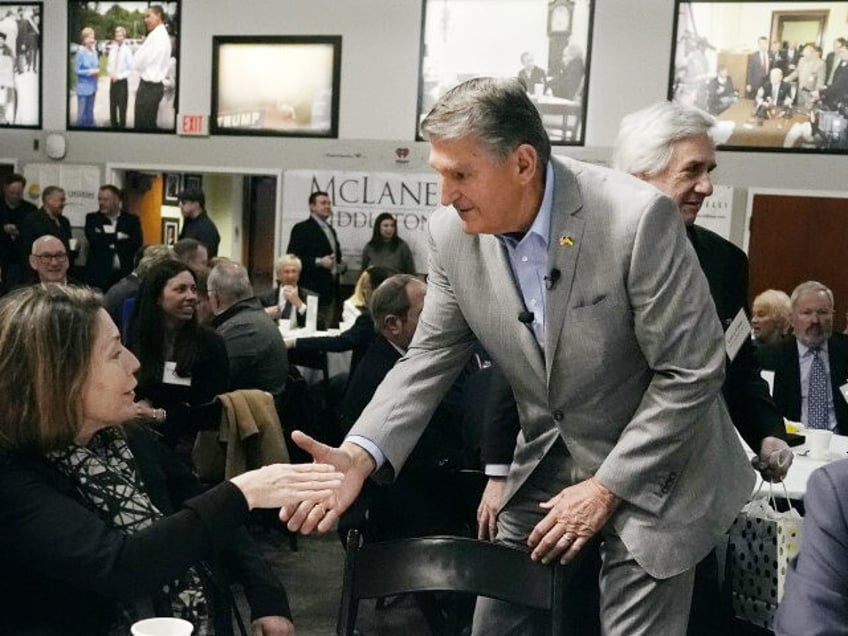 Sen. Joe Manchin (D-WV) shakes hands with guests during the 'Politics and Eggs' event, as part of his national listening tour, Friday, January 12, 2024, in Manchester, New Hampshire. Sen. Manchin announced last November that he would not seek reelection in 2024 and has teased a potential third-party run for …