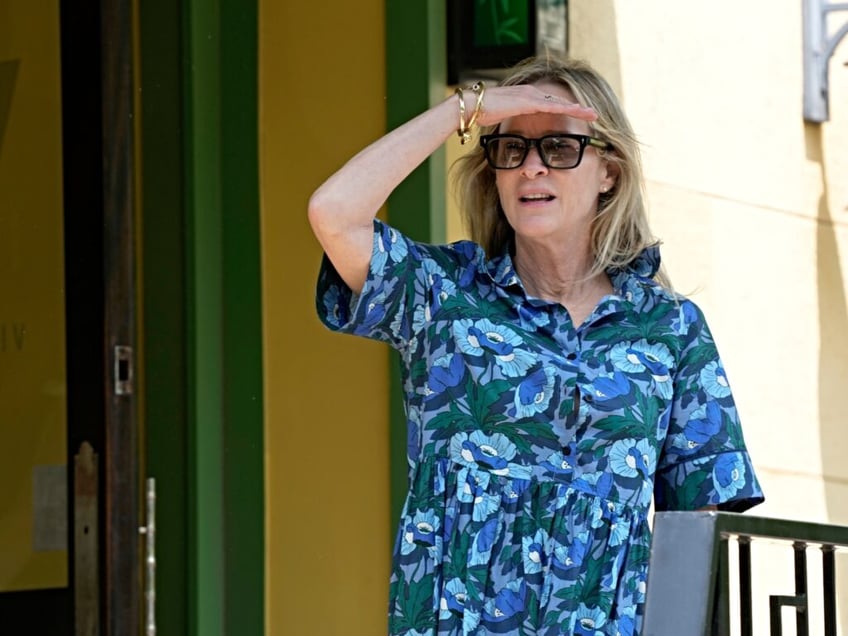 Kathleen Buhle stands outside the Vietnam Cafe as she attends a lunch with President Joe Biden and family in Philadelphia, Monday, May 15, 2023, after the President attended a commencement ceremony for his grand daughter Maisy Biden, Buhle's daughter, at the University of Pennsylvania. (AP Photo/Patrick Semansky)