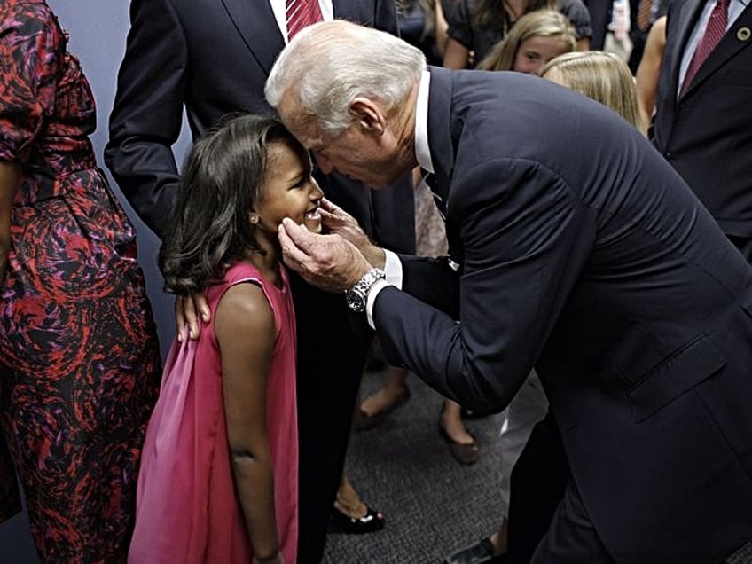 DENVER - AUGUST 28: Democratic U.S. Presidential nominee Sen. Barack Obama (D-IL) with running mate U.S. Sen. Joe Biden (D-DE), Michelle Obama, Jill Biden, and daughters Malia and Sasha on day four of the Democratic National Convention (DNC) at Invesco Field at Mile High August 28, 2008 in Denver, Colorado. Obama is the first African-American to be officially nominated as a candidate for U.S. president by a major party. (Photo by Charles Ommanney/Getty Images)