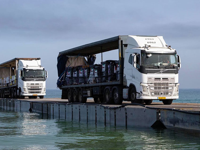 A DoD-contracted driver transports humanitarian aid from the United Arab Emirates directly